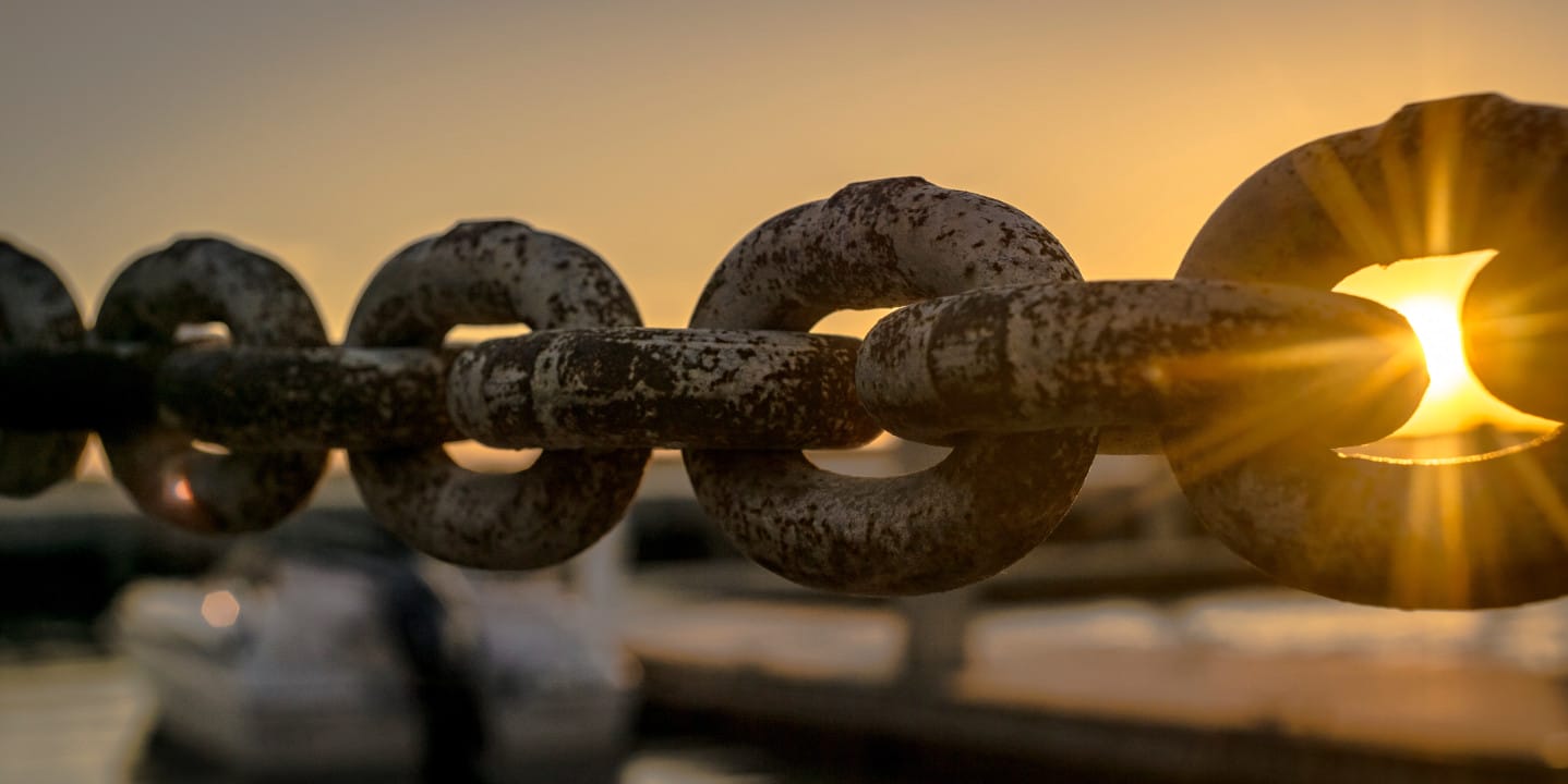 Chain with sunset in the background.