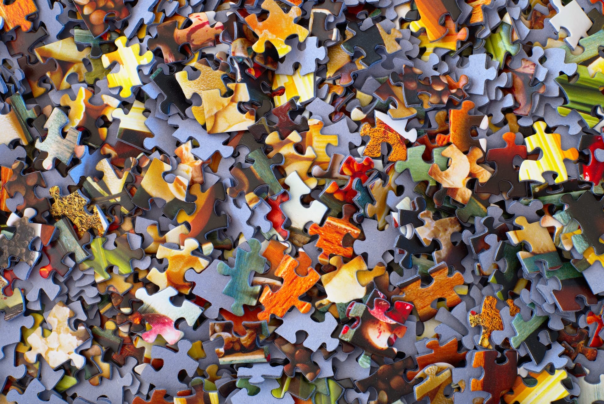 Puzzle pieces in a pile.