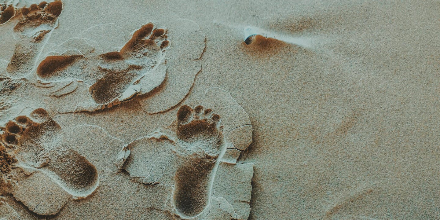 Footprints in sand.