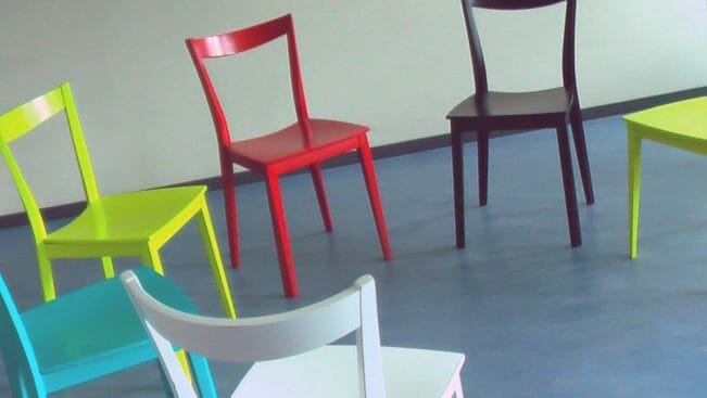 Coloured chairs in circle before AA meeting.