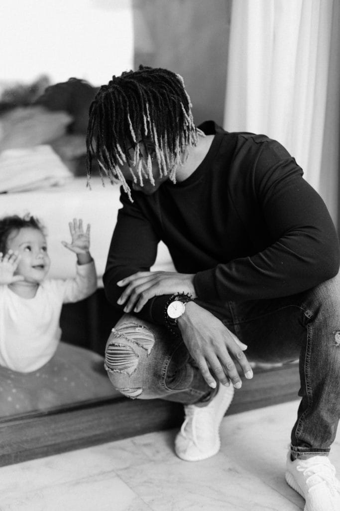 A father and daughter looking at each other.