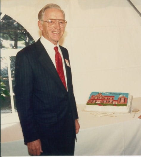 Paul Sullivan, founder, standing at Sullivan Opening party.