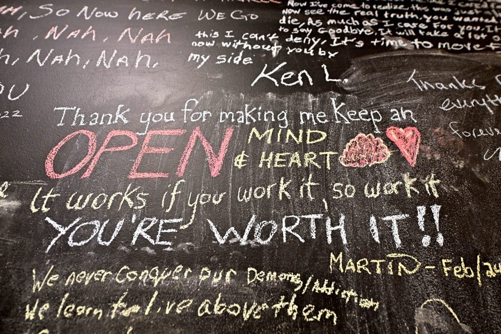Positive affirmations on chalkboard.