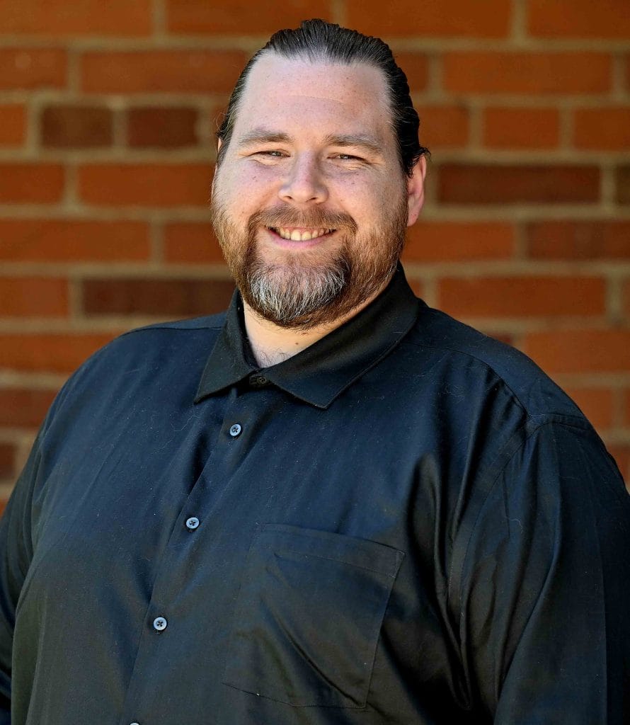 Headshot of David Charlton.